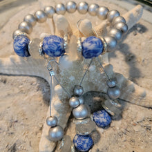 Load image into Gallery viewer, Fused Blue &amp; White beads with silver accents
