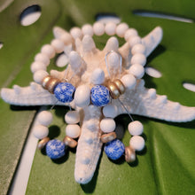 Load image into Gallery viewer, Fused Blue &amp; White beads with gold
